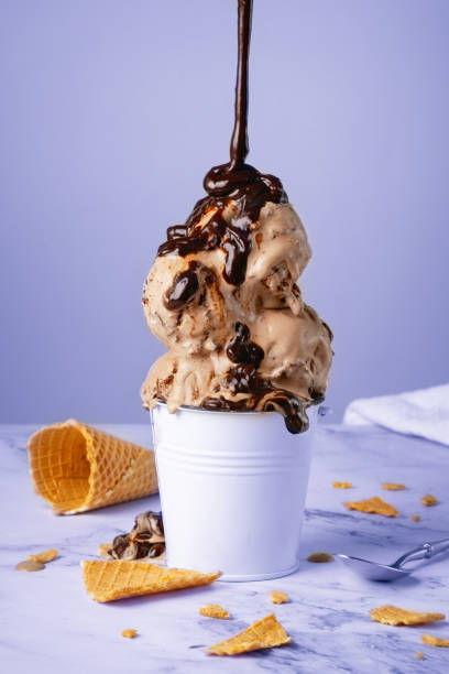 istock Chocolate ice cream with syrup in a white bucket 1495435159