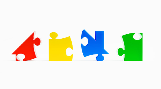 Jigsaw puzzle pieces forming which belong to a house shape on white background. Horizontal composition with copy space.