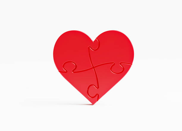 istock Jigsaw Puzzle Pieces Forming A Heart Shape On White Background 1495439558