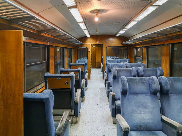 istock Old passenger train carriage with wooden interior 1495439805