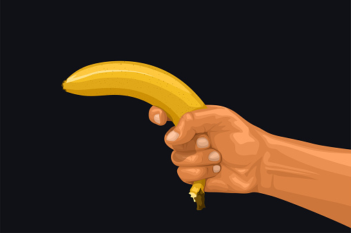 illustration of hand holding yellow banana as a gun on dark background