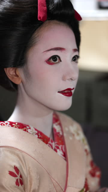Woman wearing traditional Japanese kimono to have Maiko (Geisha in training) makeover experience in Gion, Kyoto