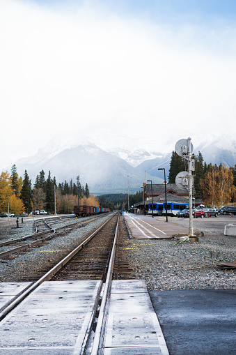 Railroad Tracks going through Jasper in front of Mountains