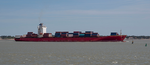 A container ship sails from Saint Nazaire in France