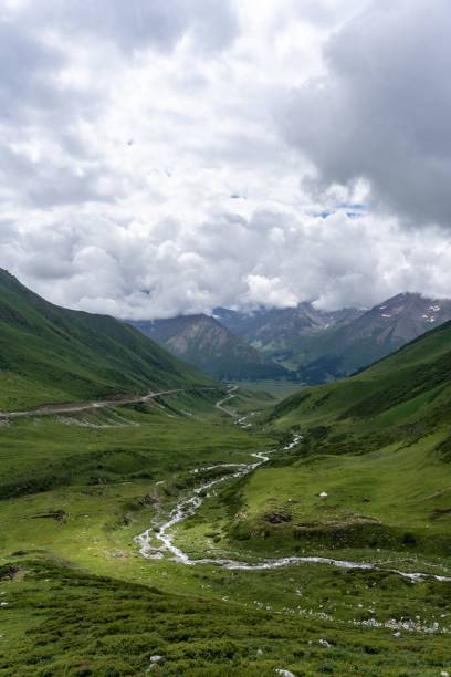 istock mountain landscape on a cloudy day with a stream running through the valley 1495448739