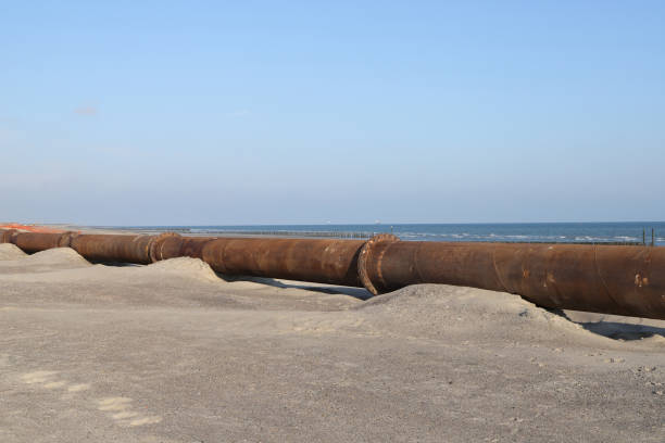 istock a steel pipe on the beach for conveying sand 1495450198