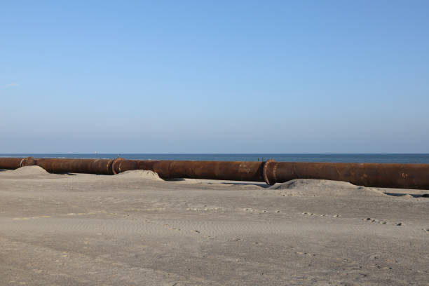 istock a steel pipe on the beach for conveying sand 1495450391