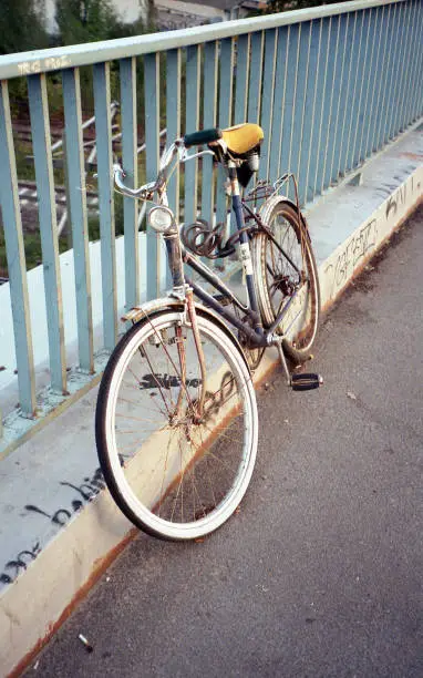 Bike leaned on bridge railing