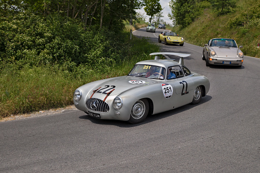 vintage racing car Mercedes-Benz 300 SL W 194 (1952) travels in the Tuscan hills during the classic car race Mille Miglia. Colle di Val d'Elsa, SI, Italy, May 17, 2014