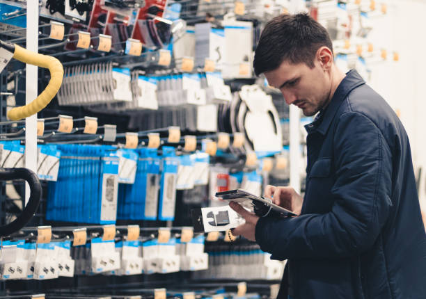 istock A young man inspects goods in a store. 1495482954