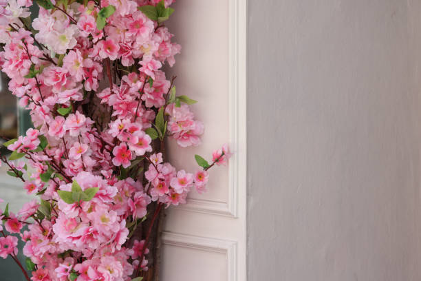 Wall and pink flowers with copy space