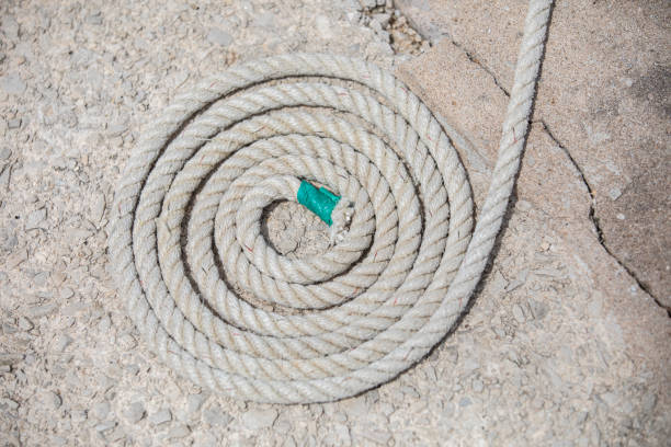 istock Rope coiled  for boating and securing small vessels. In a tangle ... like life 1495483583
