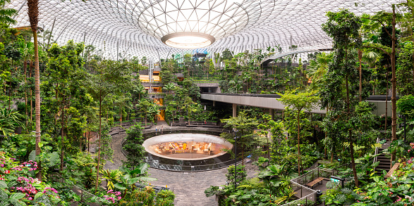 singapore. 23th april, 2023: changi airport is a nature-themed entertainment and retail complex. Its centrepiece is the world's tallest indoor waterfall, the Rain Vortex, that is surrounded by a terraced forest setting