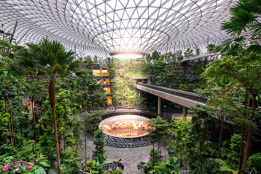 singapore. 23th april, 2023: changi airport is a nature-themed entertainment and retail complex. Its centrepiece is the world's tallest indoor waterfall, the Rain Vortex, that is surrounded by a terraced forest setting