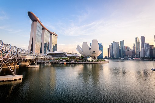 singapore. 14 th april, 2023: marina bay is the most remarkable landmark of the city in singapore. it is surrounded by an avantgarde skyline and the famous marina bay sands building.