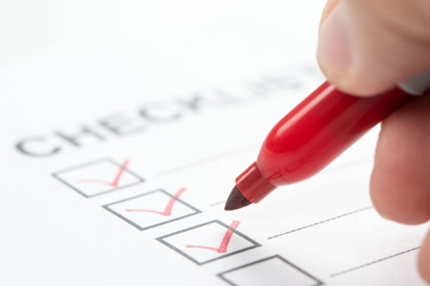 istock Hand with red marker pen marking on checklist box 1495502761