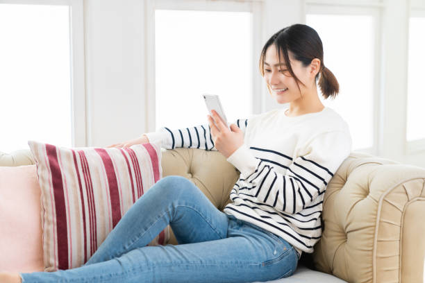 istock attractive Asian woman using a smart phone 1495506609