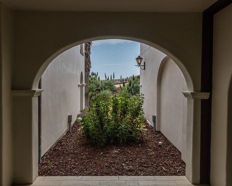 Scenic view of lush vegetation through a portal in coastal Goleta near Santa Barbara, Southern California