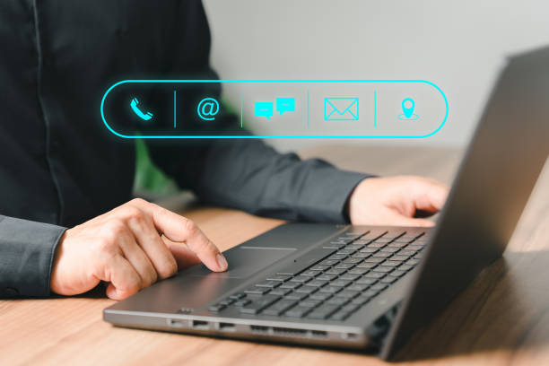 istock Client man using computer laptop with the virtual screen on the call phone, email, address, chat message and map icons. Customer support hotline contact us people connection concept. 1495516804