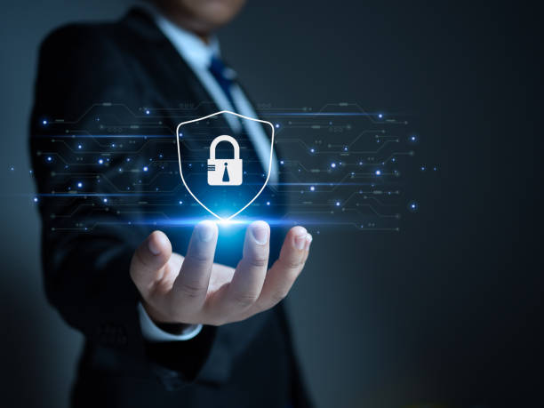 istock Businessman holding a protection sign. Represents protection against external hacks. Concepts of protection against code, viruses, firmware and malware. 1495520670