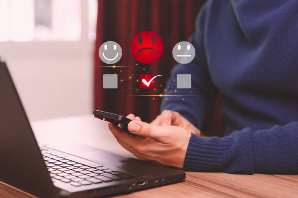istock Business service concept of customer experience dissatisfied by smartphone. Man client with angry emotion face on virtual screen. Assessment testimonial review for dislike service and low quality. 1495521762