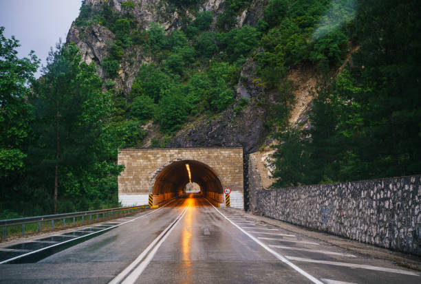 Empty highway tunnel entrance in a rainy day