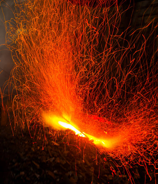 istock Line of Fire from a traditional blacksmith when making a gong, a traditional music tool from Java, Indonesia. 1495529098