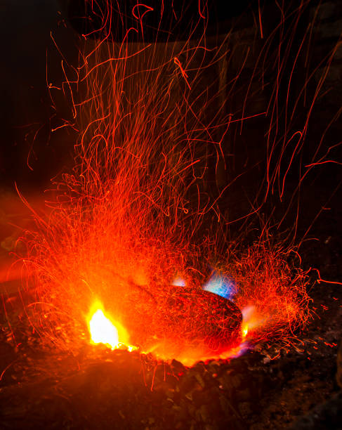 istock Line of Fire from a traditional blacksmith when making a gong, a traditional music tool from Java, Indonesia. 1495529197