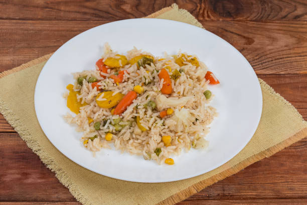 istock Rice boiled with vegetables on the white dish 1495547557