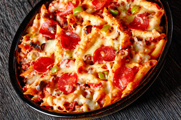 istock Pizza Casserole of pasta, beef, pepperoni, cheese 1495547978