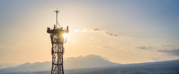 istock Panorama of telecommunication tower with 5G cellular network,  communication tower antenna at sunrise. 1495554264