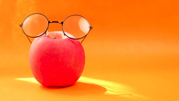 istock Red apple and glasses  with a summer concept 1495557663