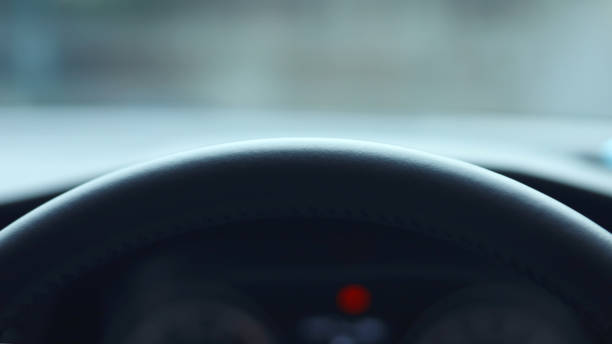 istock Close up car steering wheel. Half steering wheel on car. 1495558552