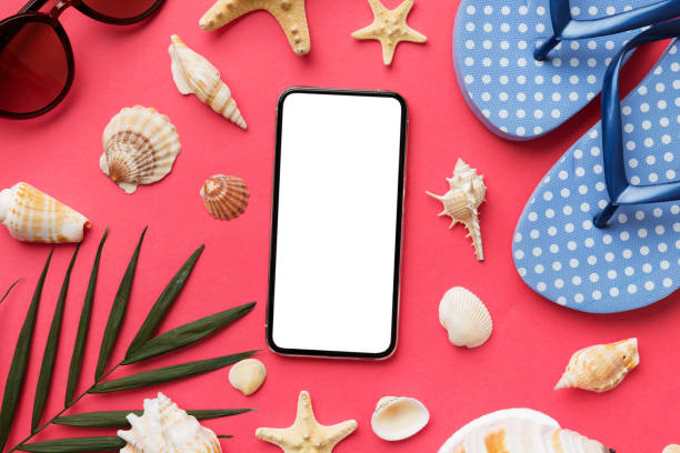 istock Flat lay composition with Phone and beach accessories on colored background. Smartphone with blank screen mock up with copy space 1495565189