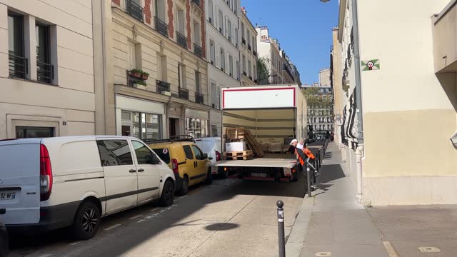 delivery van opening backdoor in Paris street