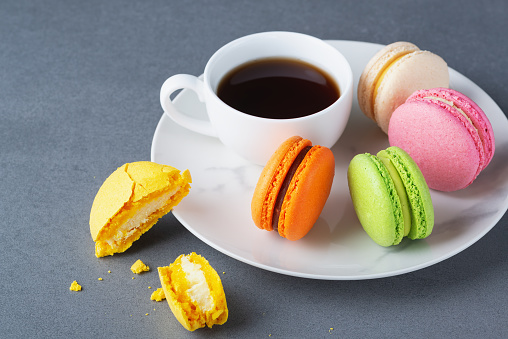 Colorful macaroons and coffee.