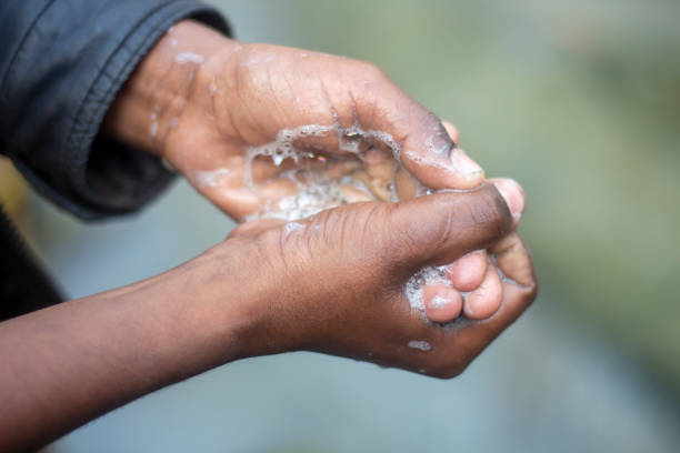 istock A man is washing his hands with soap 1495570424
