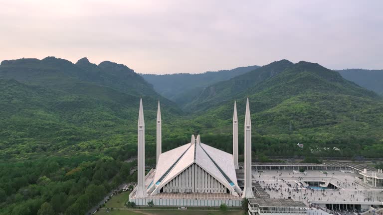 Aerial Drone Sunset Scene of Shah Faisal Mosque is one of the largest Mosques in the World which is situated in Islamabad, Pakistan.