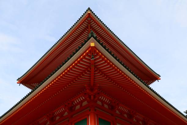 istock Vivid red Japanese building situated against a stunning blue sky 1495577147