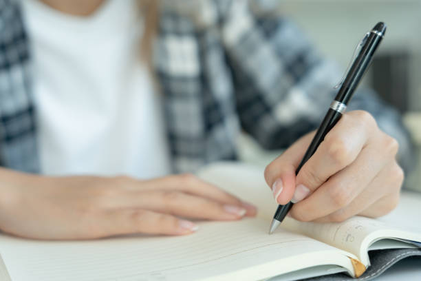 istock Student, use left-handed, inspiration, writer, writing ,creative ,recreation for imagine, writing ideas on notebook, to do list, good thinking work, journalist, Stylish, Dream image, relax, designer 1495579302