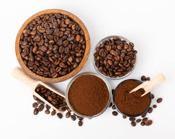 istock Coffee beans in bowl isolated on white background. 1495580694
