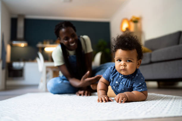 istock Mom and baby son playing at home 1495584610
