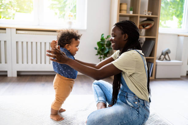 istock Mom and baby son playing at home 1495584640