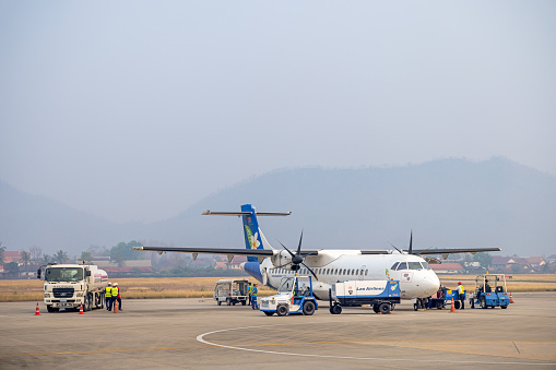 Military air force plane and armed forced soldier on ground