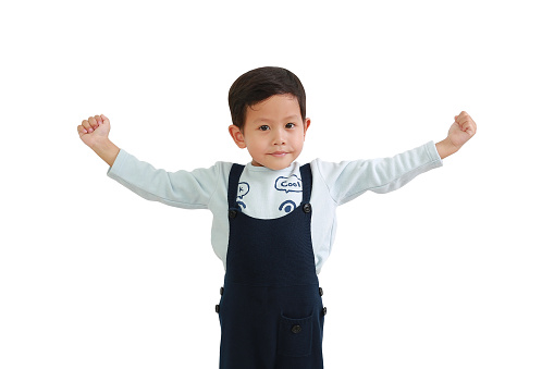 Strong Asian little boy raising hands up isolated on white background. Image with Clipping path