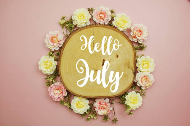 istock Hello July typography text decorate with flower on pink background 1495589496