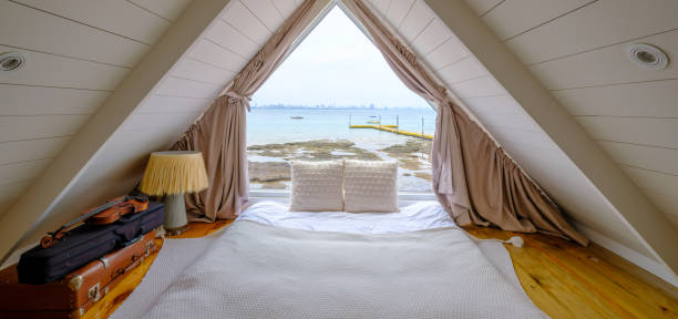 istock Attic bedroom with sea view 1495589551