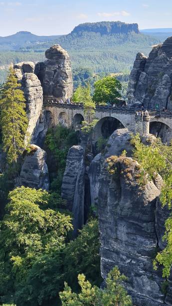 istock Scenic view of a bridge surrounded by cliffs and greenery. Saxon Switzerland, Germany. 1495592081