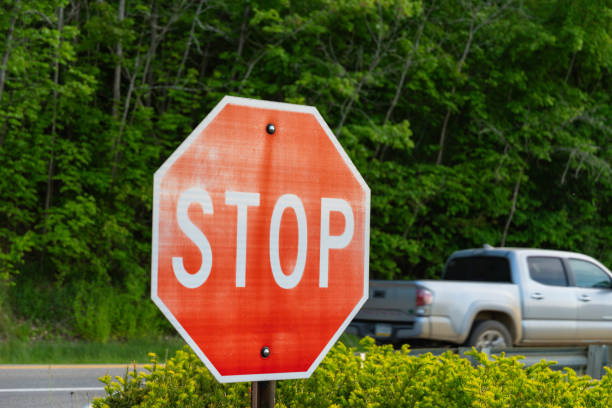 Stop sign copy space design textured backgrounds cars passing by