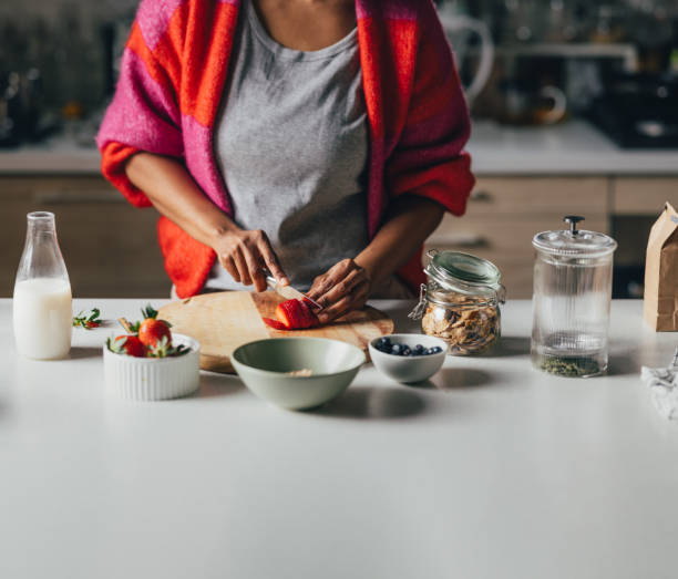 istock An Unrecognizable Woman Preparing Healthy Breakfast In The Kitchen 1495599805